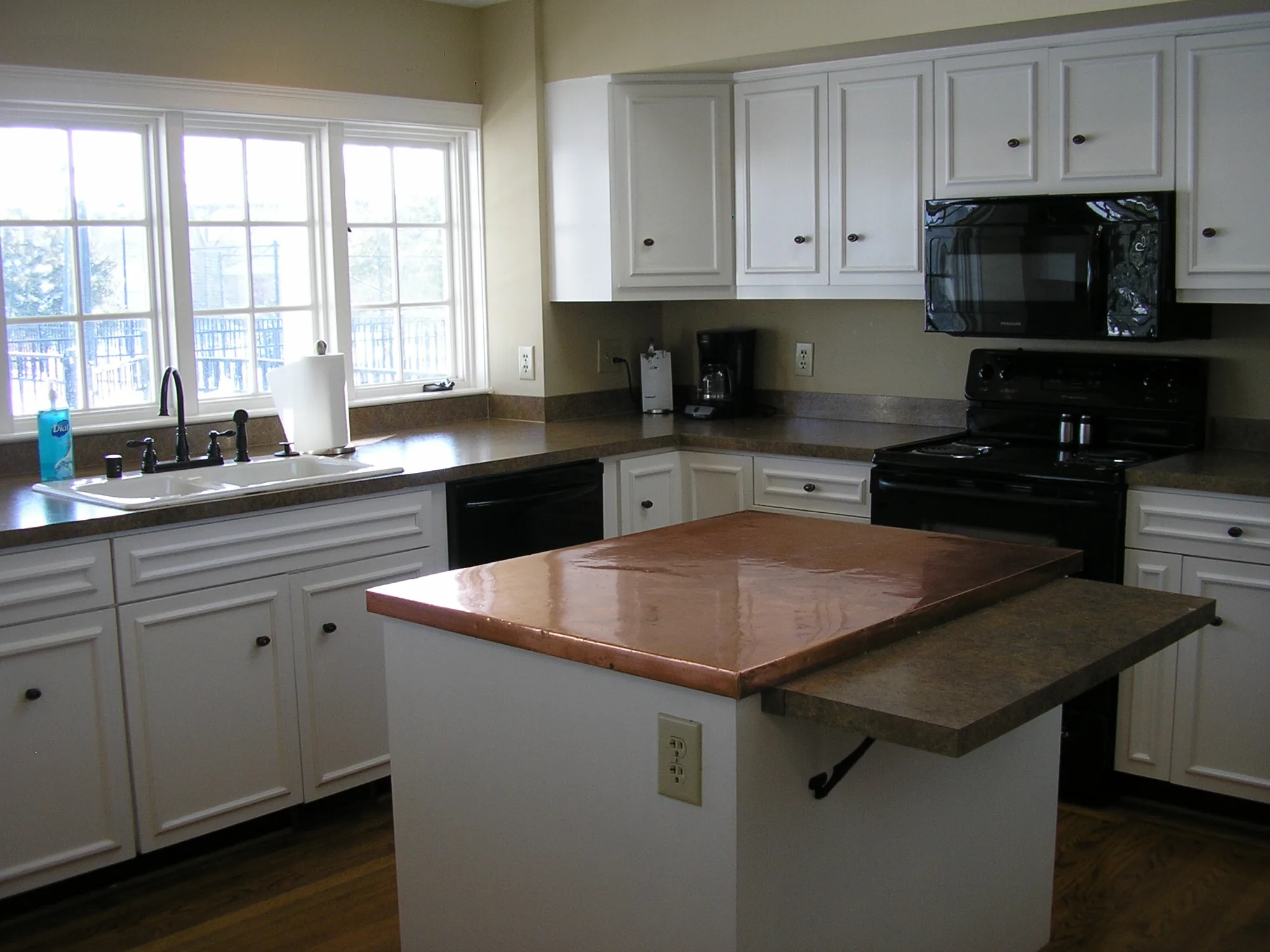 The kitchen with island and range